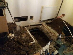 Digging up the floor this new year to find the burst water main.